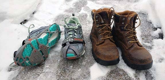 On the right are New Balance running shoes with Yak Trax. The Trax should be better centered on the toe, but they worked for now. On the left are the work boots from Carhartt that double as winter and hiking boots. I wear extra socks in winter.