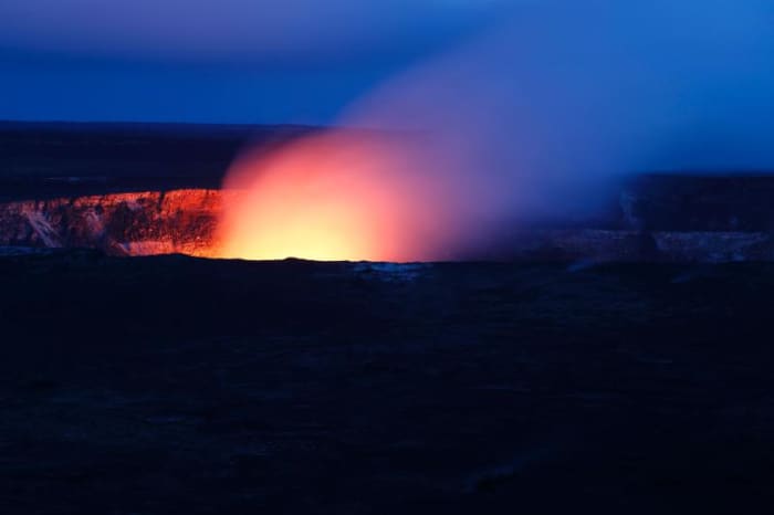 Lava glow in 2018 as evening falls on Halema'uma'u, the inner crater of Kilauea, Hawai'i Volcanoes National Park, Island of Hawai'i, HI