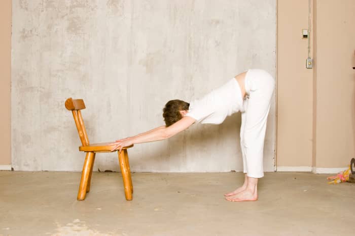 Supported Downward Facing Dog on a Chair This is a gentle variation for people with high blood pressure or wrist or shoulder injuries.