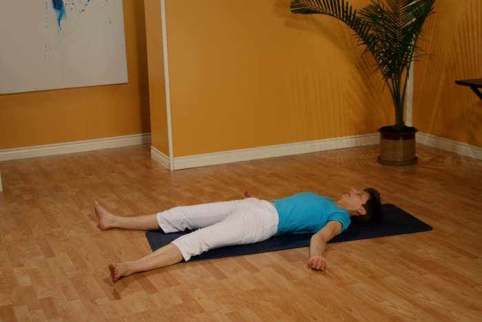 Relaxation position for the final guided relaxation. If it is hard to get down to and up from the floor, relax on the bed or sit in the chair and watch your breath.