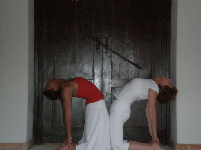 Camel, or Ustrasana stretches the quadriceps at the front of the thighs, as well as strengthening the abdominals and back.