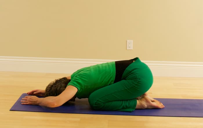 Rest in Child Pose to allow the blood pressure to equalize and to ease tension from the neck. Then lie on your back in Svasana Corpse Position.