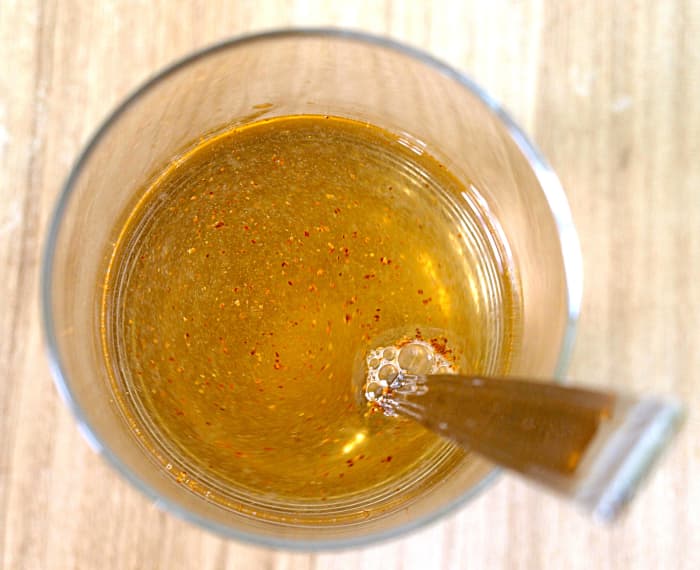 The last step is to add the cayenne pepper and water. I recommend drinking the lemonade fresh—it will taste more acidic after refrigerating.