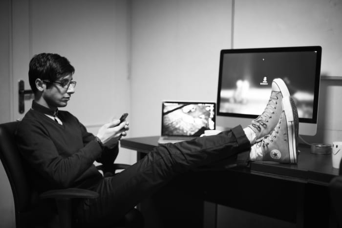 You probably shouldn't do this at your desk, but you can still tap your foot to keep the blood flowing!