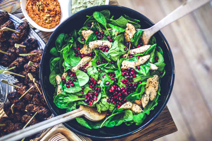 Include baby spinach easily into your diet by tossing them with some grilled chicken breast for a filling and delicious lunch. Photo by Kaboonpics .com. CC0 Creative Commons
