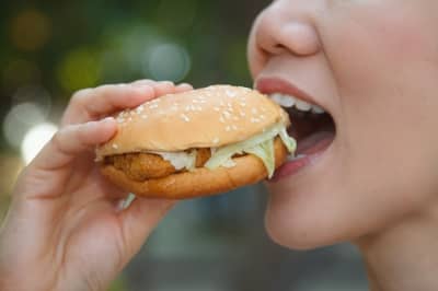 Most people in the modern west overeat. Control your portions, eat a balanced, healthy diet, and stop eating before you feel "full" if you want to lose weight