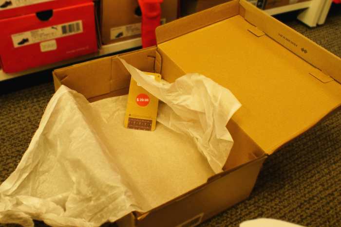 Shoe tags in an empty box right in front of a camera—oops.