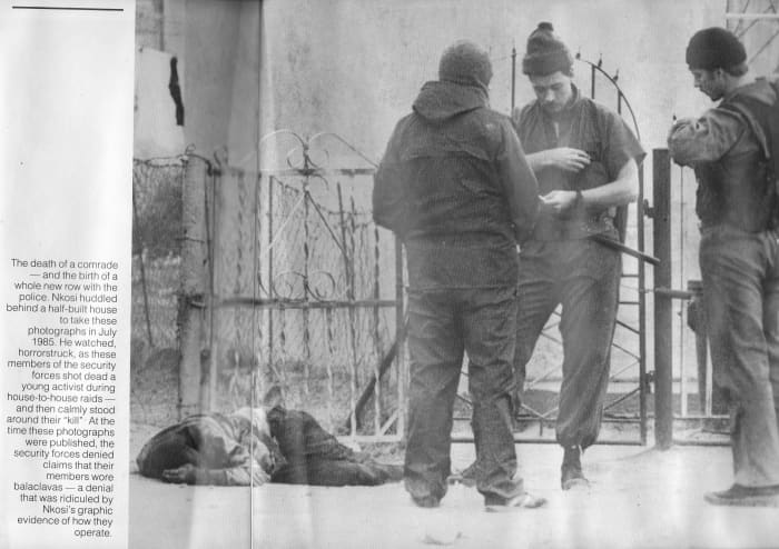 Members of the security forces shot a young activist during house-to-house raids. Members of the security forces calmly stand next to their "kill"; Below, the members of the security forces denied wearing 'balaclavas' but were exposed by this photos