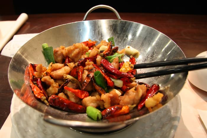No, not all of us cook with woks. It's only used in Chinese cuisine for the most part and no, I don't own one!