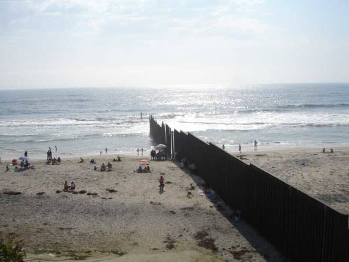 The beach at Tijuana viewed from the Mexican side of the border. The Pacific Ocean can be seen as well as the barrier that marks the border. Amnesty critics often argue that more preventative means need to be in place to stop illegal immigration.