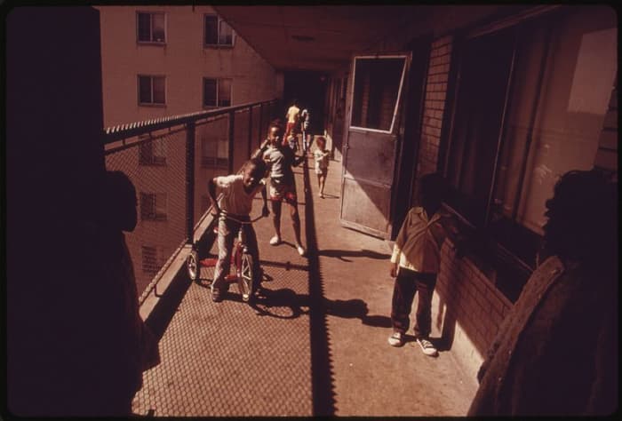 Residents on one of the balconies of the Robert Taylor homes, a low income, high-rise apartment building in Chicago.