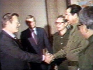 Iraqi President Saddam Hussein greets Donald Rumsfeld, special envoy of President Ronald Reagan, in Baghdad on December 20, 1983.