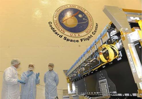 Peter Hildebrand (NASA), Masahiro Kojima and Takeshi Miura (JAXA) in the clean room with the DPR. Ongoing Japanese - American Project: Dual-frequency Precipitation Radar.