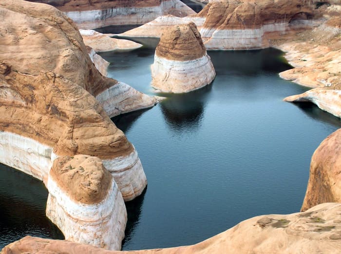 Bathtub rings on the surface of the rock at the river's edge tell the story of declining water levels.
