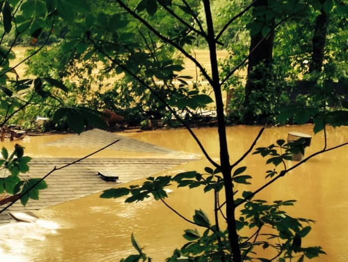 As the mighty Elk River extended its borders homes were engulfed by the raging waters. Disappearing into the muddy waters and blending in with the river.