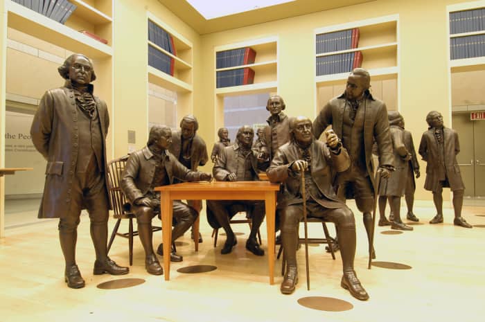 Some of the 42 bronze figures of the signers of the U.S. Constitution, at the National Constitution Center, Philadelphia, PA