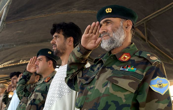 Afghan National Army Air Corps Brig. Gen. Mohammad Yousaf renders honors July 31, 2007 during a historic change-of-command ceremony at Kandahar Air Field, Afghanistan