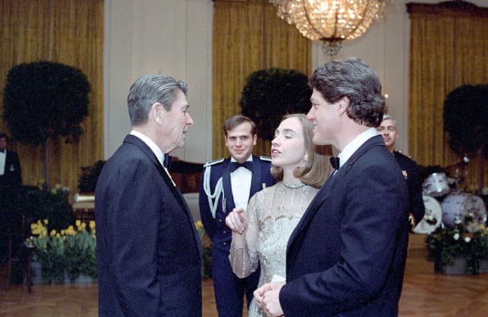 President Reagan with Bill Clinton and Hillary Clinton at a dinner in Honor of State Governors in the East Room in 1983.