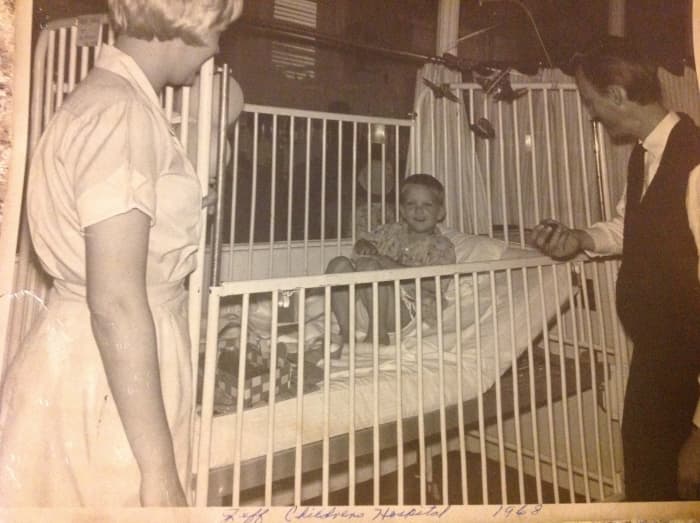 Me having surgery at five years old. They still had me in a crib, not because I needed one but so they could tie me to the bed at night. The would tie the opposing arm and leg so I wouldn't roll over on the catheter in my sleep.