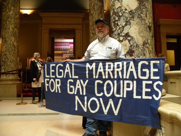 A pro-gay protester outside the Minnesota State Senate.