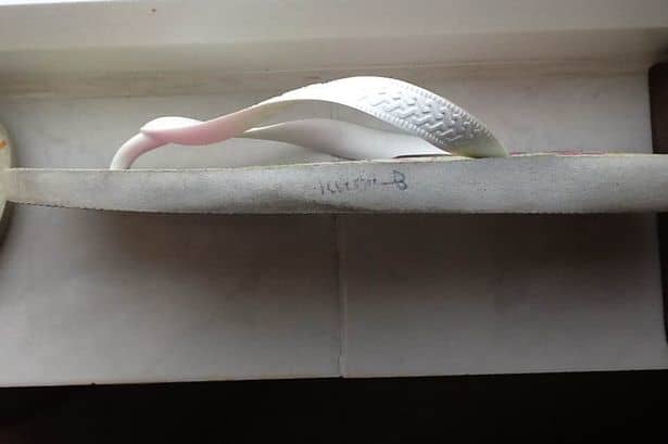 This is one of the flip flops the ship captain gave her parents. The name clearly does not say Rebecca