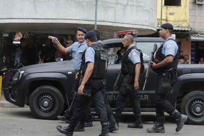 Police officers in the favela of Rocinha. Brazil suffers from high crime and murder rates.