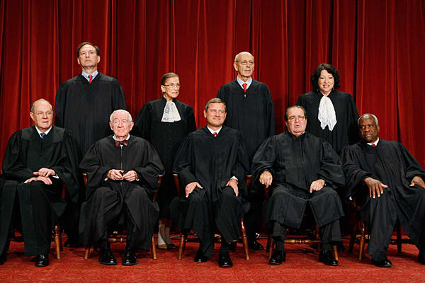 2009-2010 Supreme Court. Front L-R: Kennedy, Stevens, Roberts, Scalia, Thomas. Back Row: Alito, Ginsburg, Breyer, Sotomayor. Unlike his colleagues, Thomas went years without asking a single question.