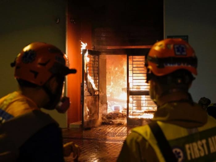 Protesters in Hong Kong: Petrol bombs were thrown at the lobby of a residential compound in protest against a plan to turn the building into a quarantine zone.