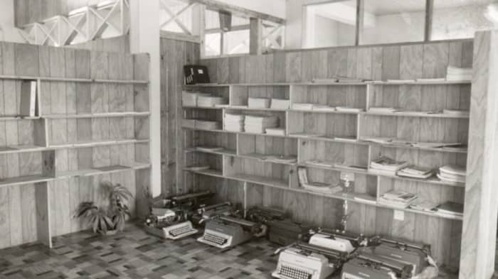 And we finally got shelves! Note the typewriters in use then. We only had one computer—donated by IBM for use by our accountant.
