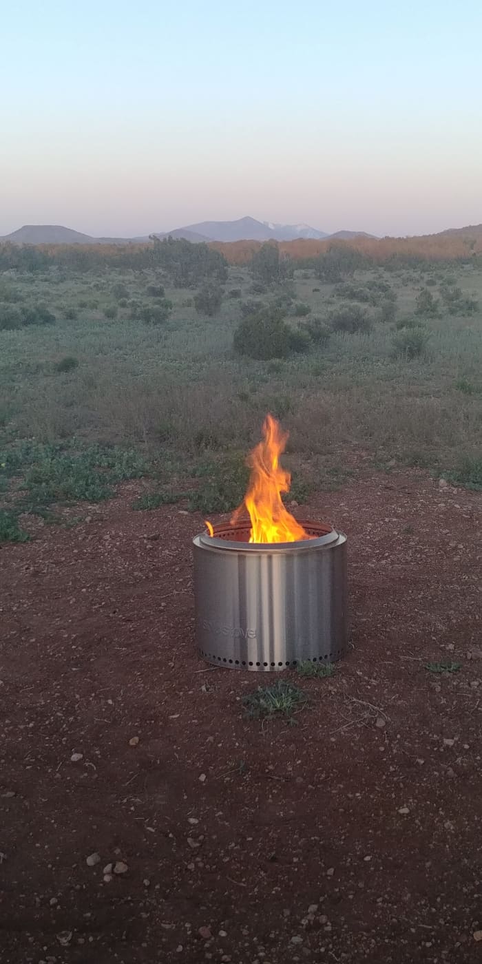 Our Solo Stove in action in a clearing on our property, with a view of the San Francisco Peaks near Flagstaff, AZ.