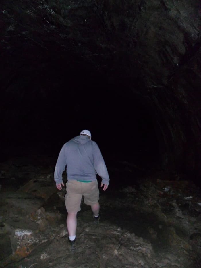 My son, Jeff in the Lava River Cave. You can see some ripples in the floor near his left foot.