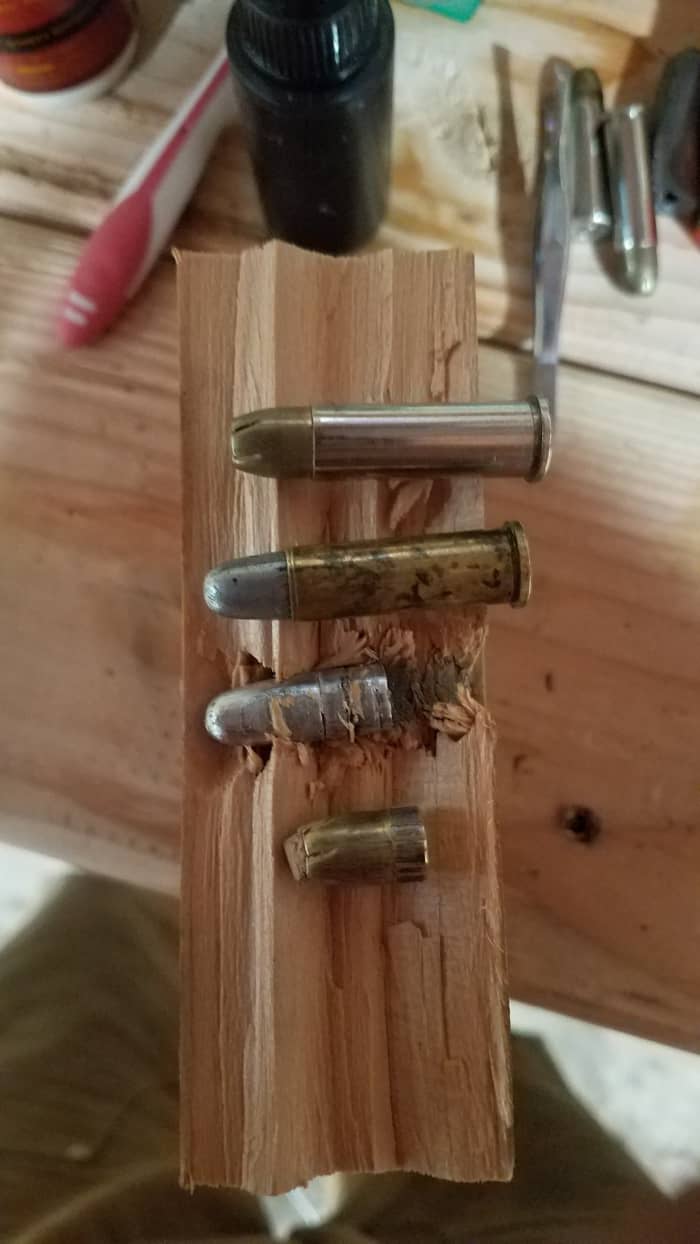 From the top; Factory Remington Golden Saber, 200 grain handload, 200 grain bullet in wood block, unexpanded fired Golden Saber