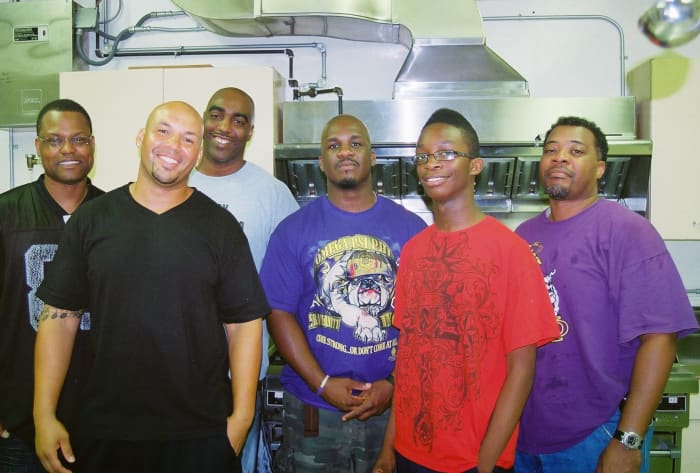 Volunteers and members of Psi Nu Chapter of Omega Psi Phi Fraternity, Inc. are regulars at the bi-weekly program.
