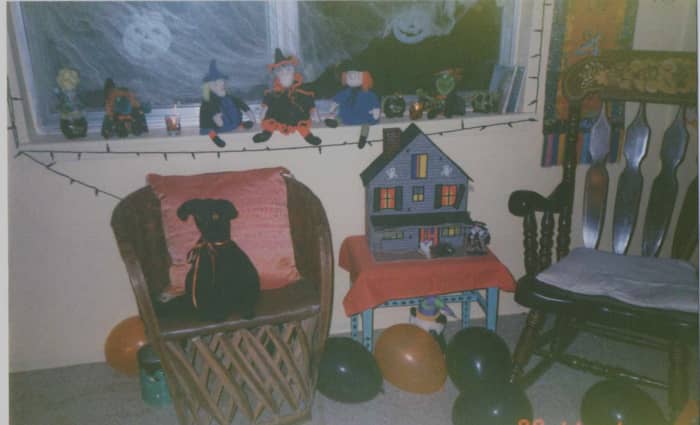 The house that burned. A collection of my Mother's crocheted witches and one of our plastic canvas haunted houses.