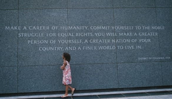 A young girl takes in the message at the Martin Luther King, Jr. National Memorial in Washington, DC.