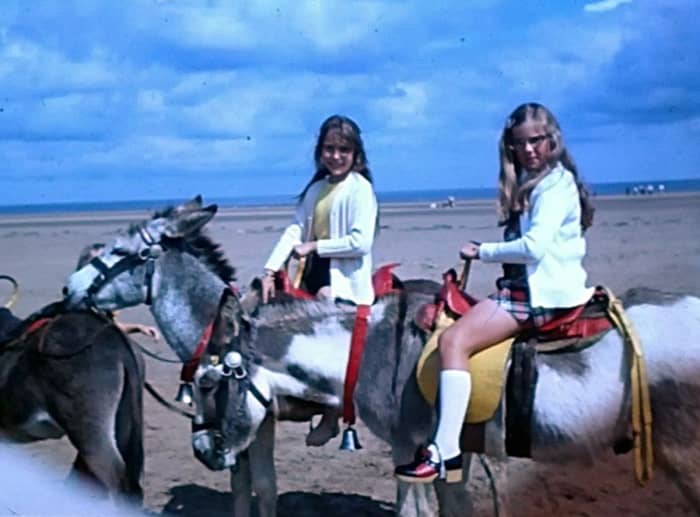 I am pictured, on the left, with my cousin Sharon, enjoying a donkey ride on the beach near where I lived. I started longing for a pony of my own at this time.