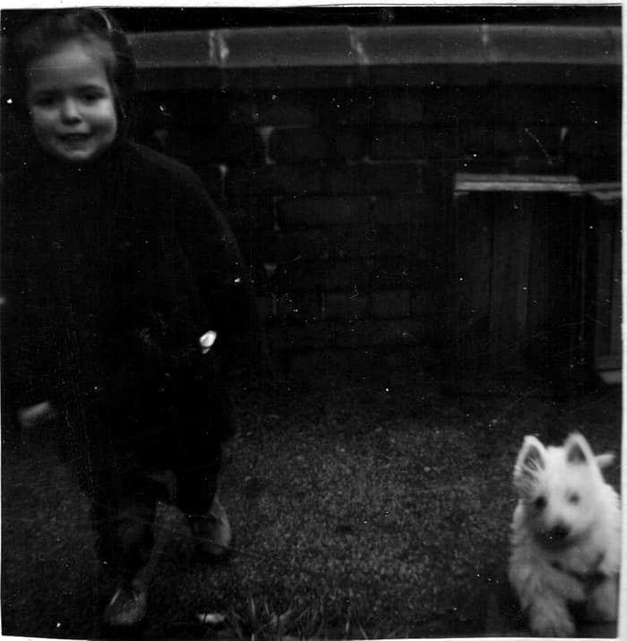 Me aged about 18 months with Mitzie - my West Highland Terrier - when she was a tiny puppy. We were inseparable from this time onwards.
