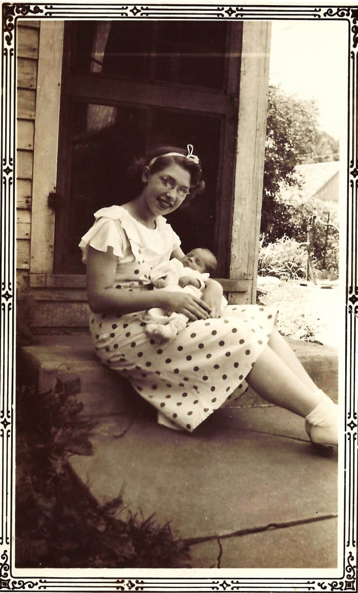 Emma and her new baby boy (who would become my husband 26 years later).