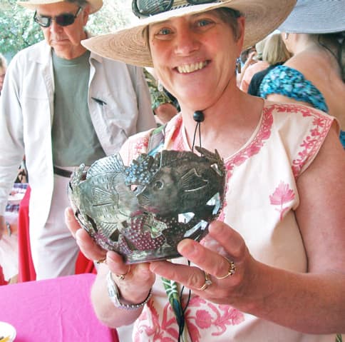 Our hostess bought a fish-themed candle holder made in Haiti from recycled steel drums.