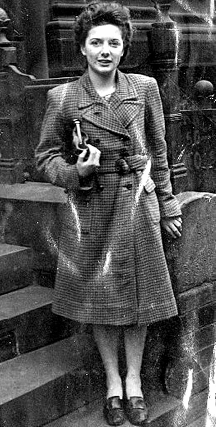 Mum aged 15, pictured in London, where she met the Queen to hand over a purse of money from the YWCA to aid the war effort.