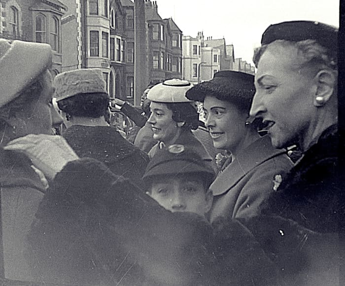 The wedding guests wave off mum and dad as they embark on their honeymoon. Dad's older sister Olive is in the white hat; next to her their sister Josie and in front my brother Eric.