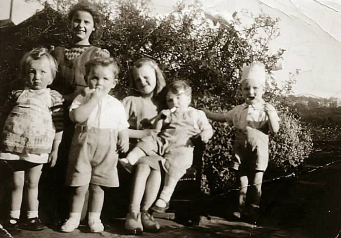 A family photo from around 1949: On the right is my brother Eric as a toddler, with my mum's cousins Shirley (standing at the back); Sandra (sitting on the bench) and Paul (standing at the front). The other two were neighbours' children.