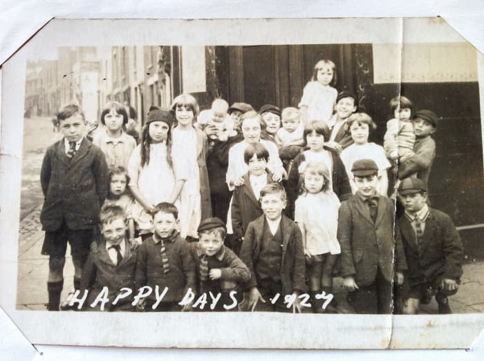 Neighbourhood children outside the pub at the entrance to Fleet Street