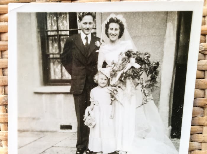 My parents outside the house on Fleet Street on their wedding day. The bridesmaid is one of my cousins.