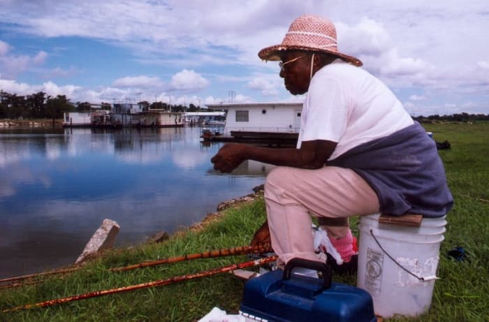 Woman cane fishing in Morgan City, LA.