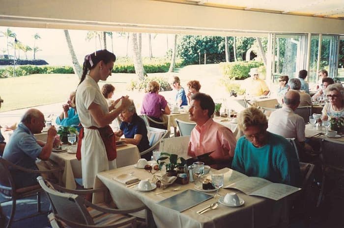 Waitress taking an order at Kahala Hilton Hotel, Hawaii, USA.