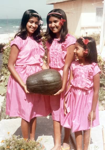Pic8: My Younger Sister and Me Holding Our First Garden Pumpkin While Our Little Sister Smiles and Looks on