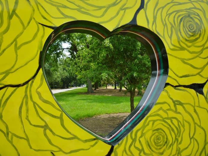 Looking through “Heart of the Heights” sculpture by Eisenhut/Ramos in True South sculpture exhibit in Houston