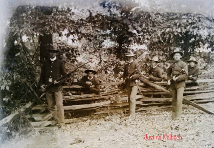 What looks to be Soldiers from the Spanish American War, holding bayonets while posing for the photo. April of 1898 makes it probable for young William to be the one who fought in this war.