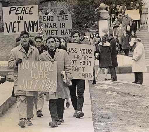 Student protesters marching down Langdon Street at the University of Wisconsin-Madison during the Vietnam War era in 1965.